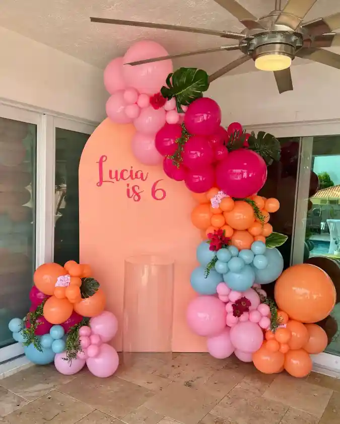 Sunset Hued Tropical Balloon Arch and Backdrop