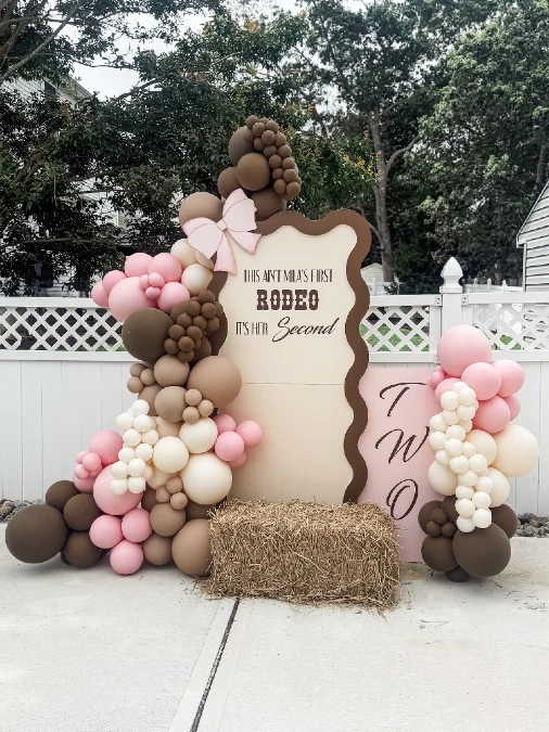 Earthy Rodeo Backdrop with Hay Bale