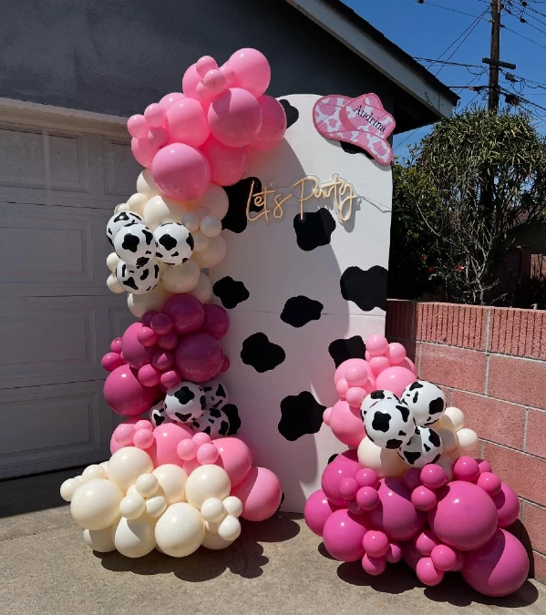 Cow Print Arch with Neon Party Sign