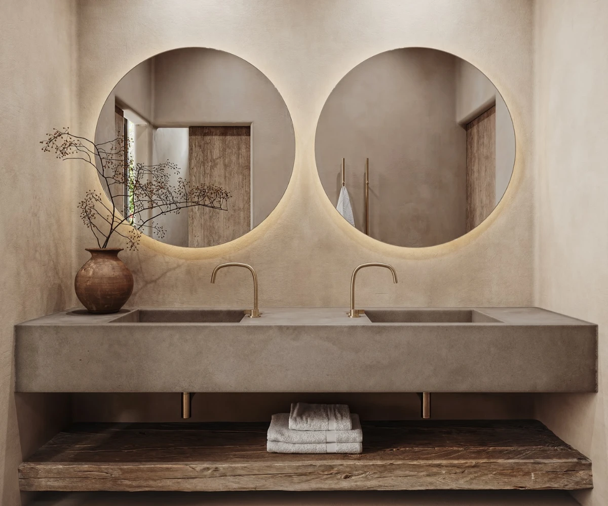 Double Concrete Sink And Round Mirrors