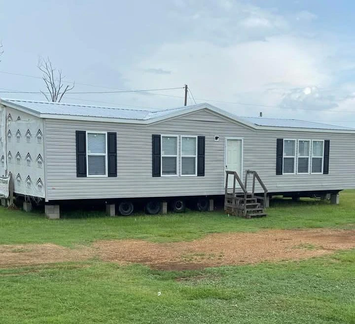 Gray Mobile Home with a Metal Roof