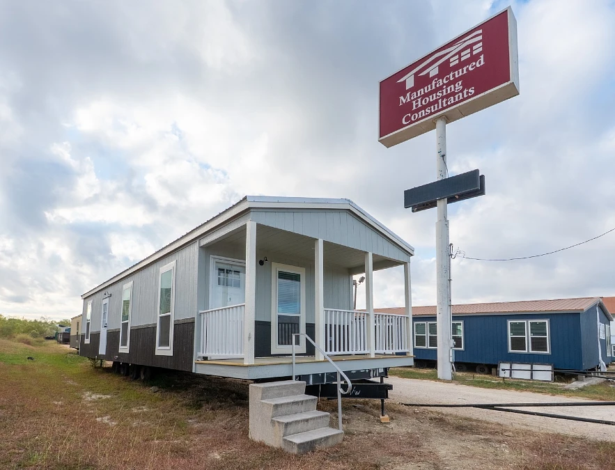 Gray Mobile Home with a Covered Front Porch