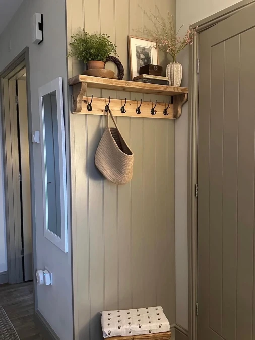 Rustic Wood Shelf On Paneled Wall